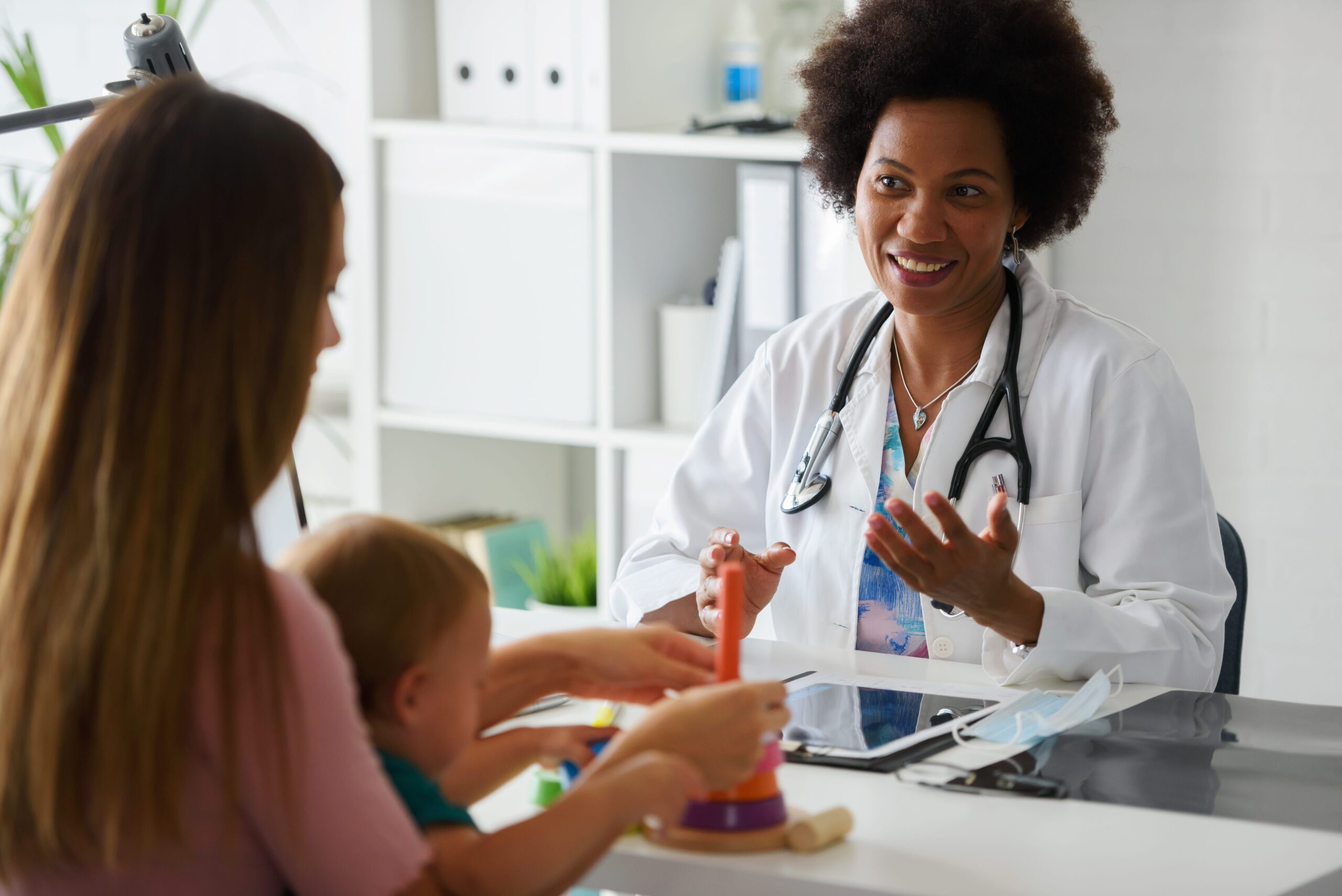 A woman discusses treatment with her doctor