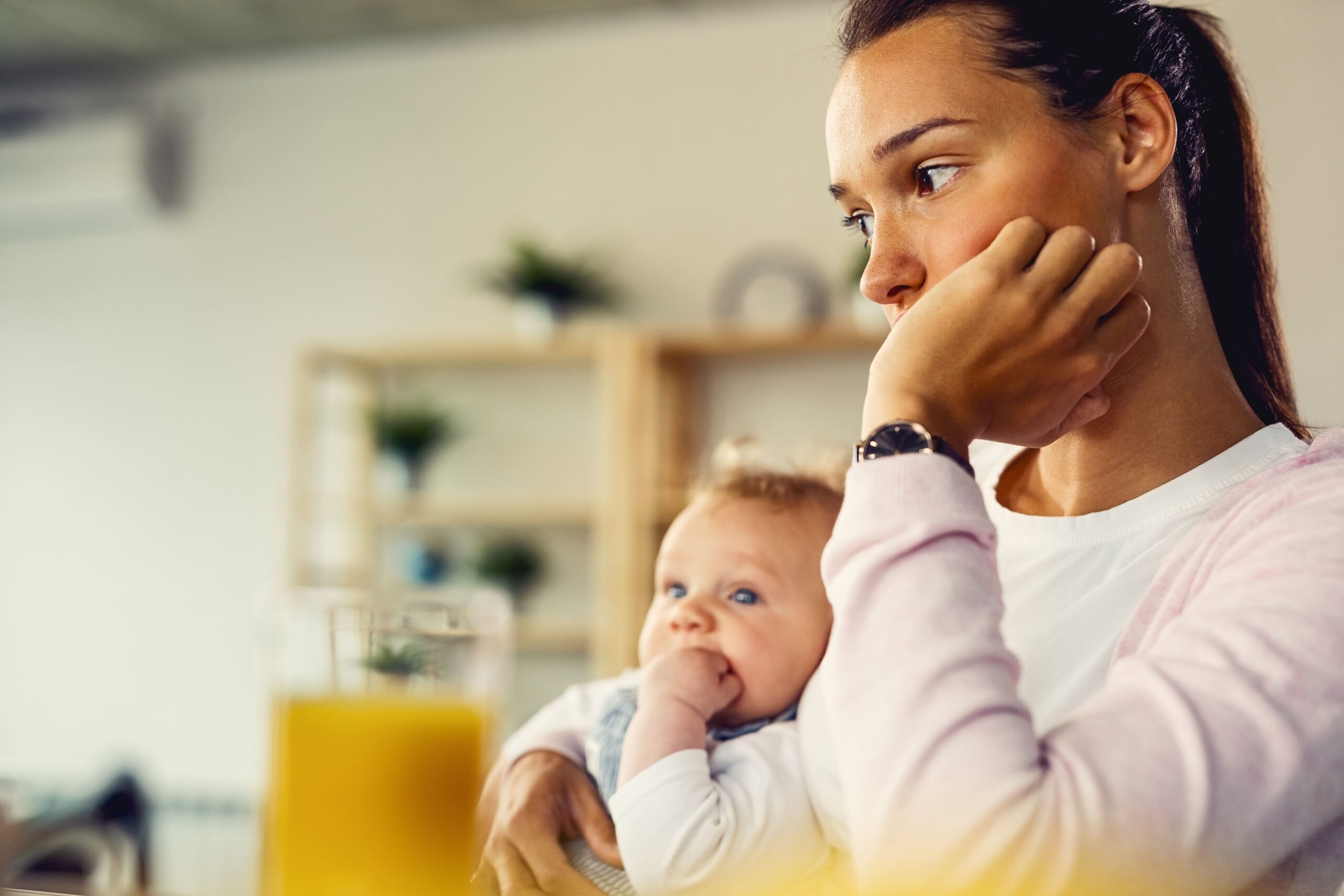 A woman considers postpartum depression treatment in New Jersey