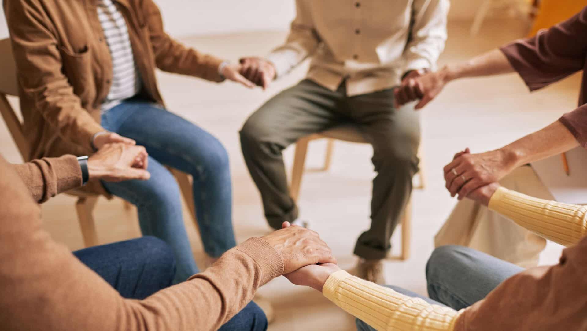 People supporting each other during group therapy in New Jersey.