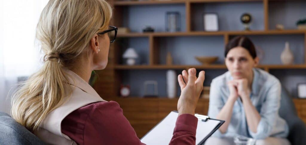 Therapist supporting a client during addiction treatment in New Jersey.
