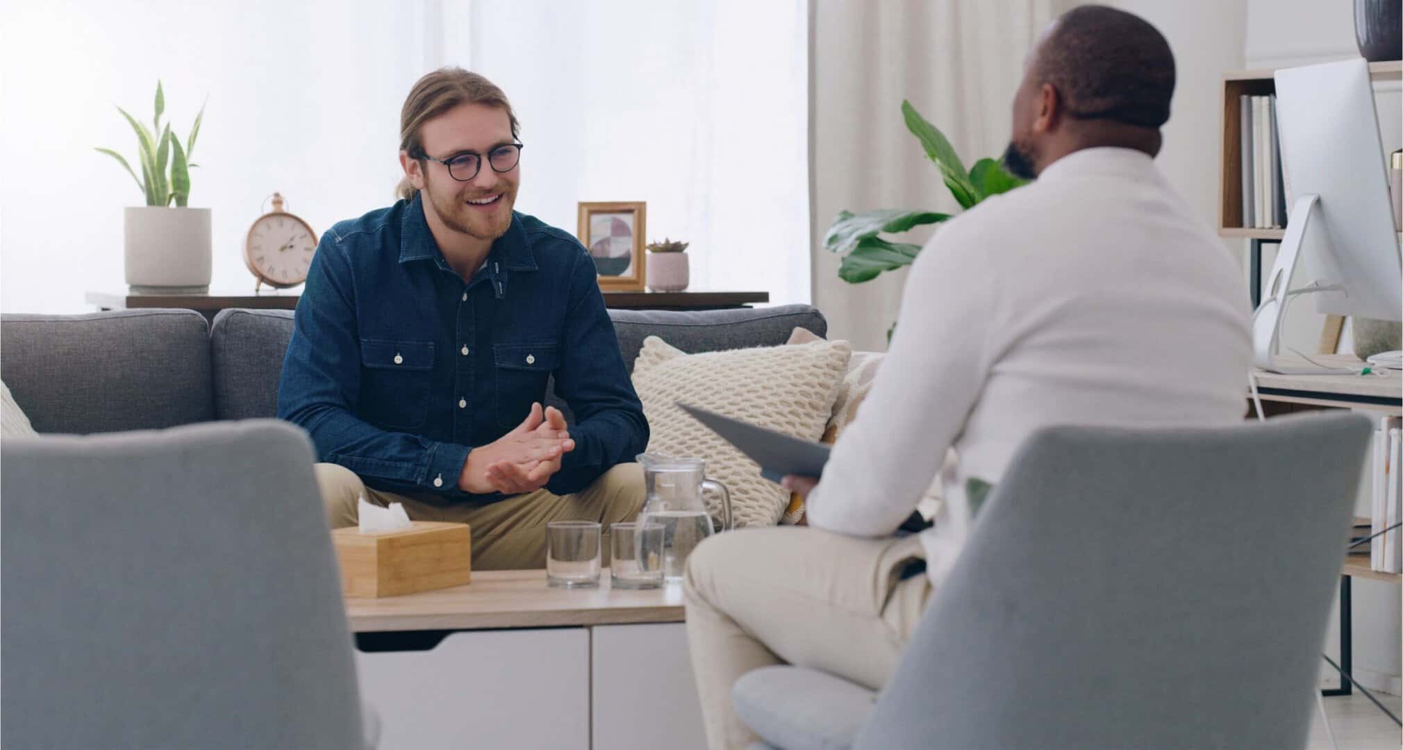 A man enjoys aftercare services through personalized individual therapy.