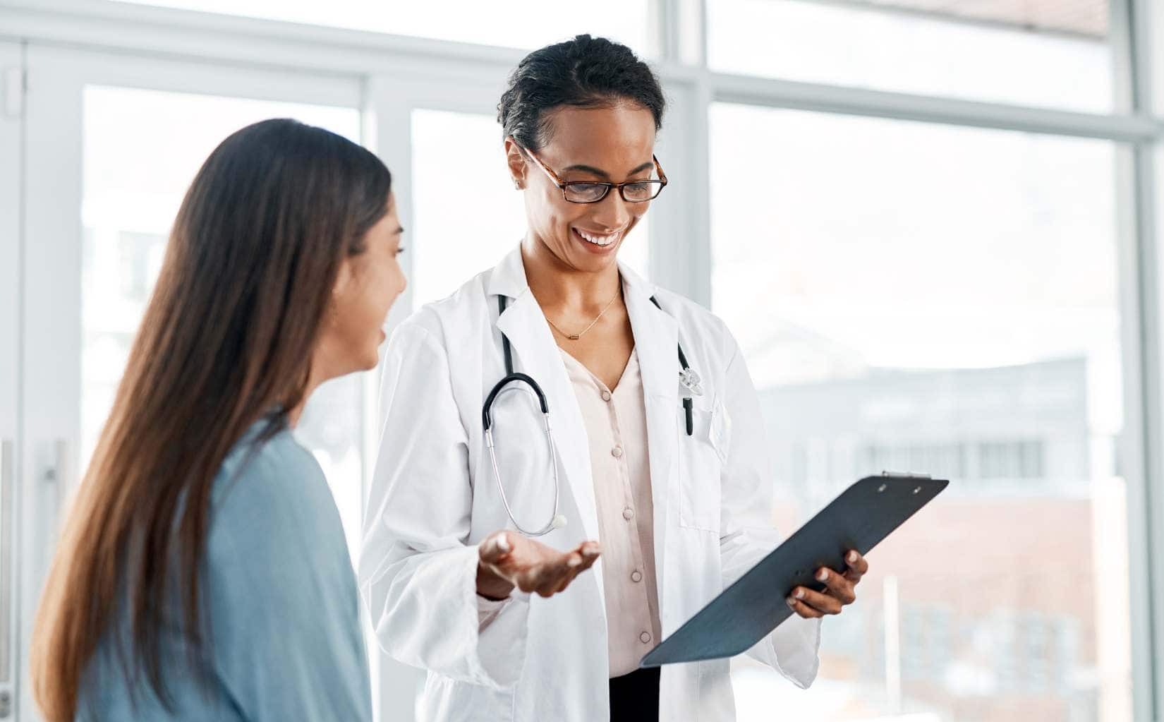 Smiling doctor supporting a client during alcohol detox in New Jersey.