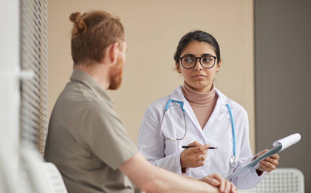Professional guiding a client through heroin detox in New Jersey.