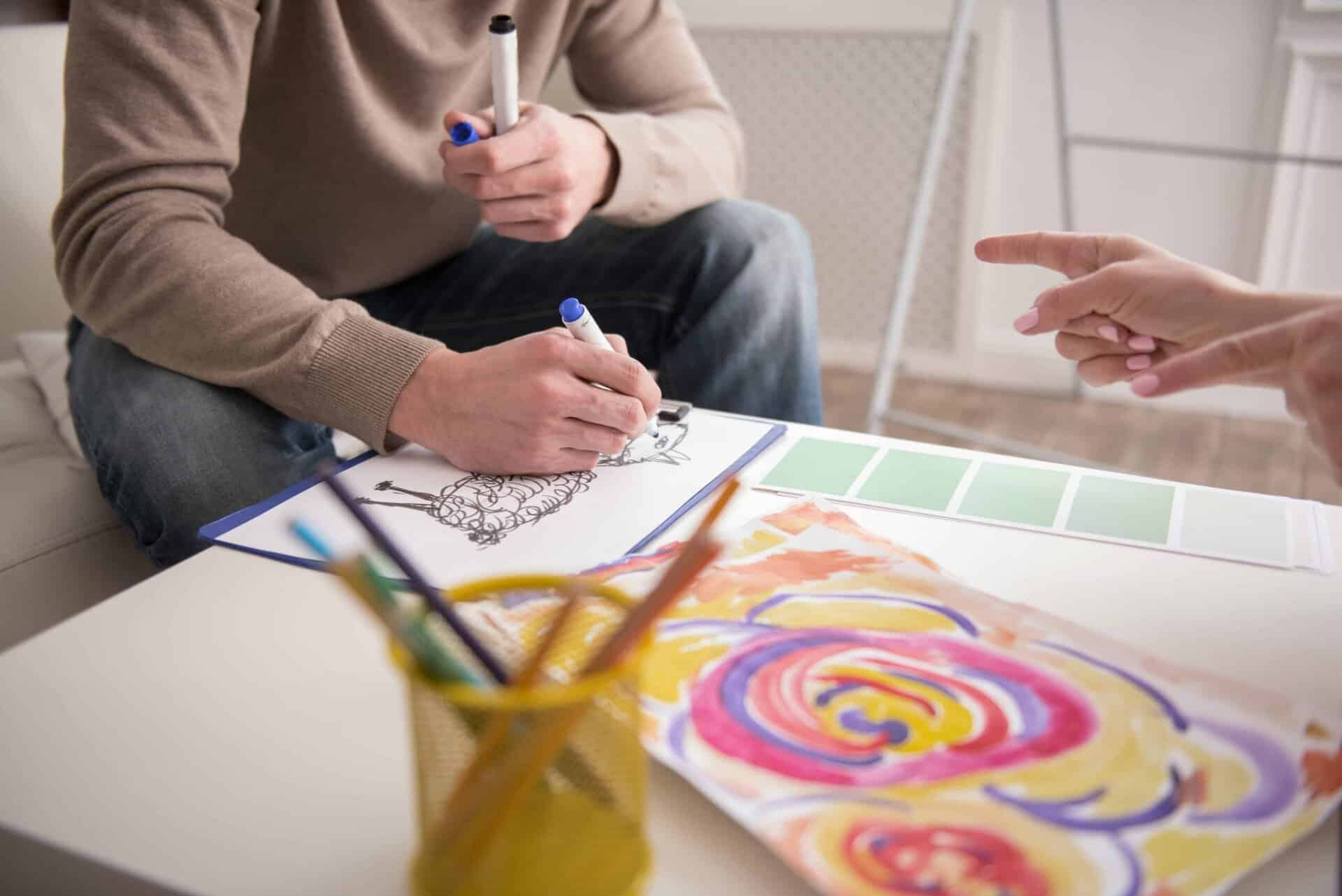 client painting in art therapy session