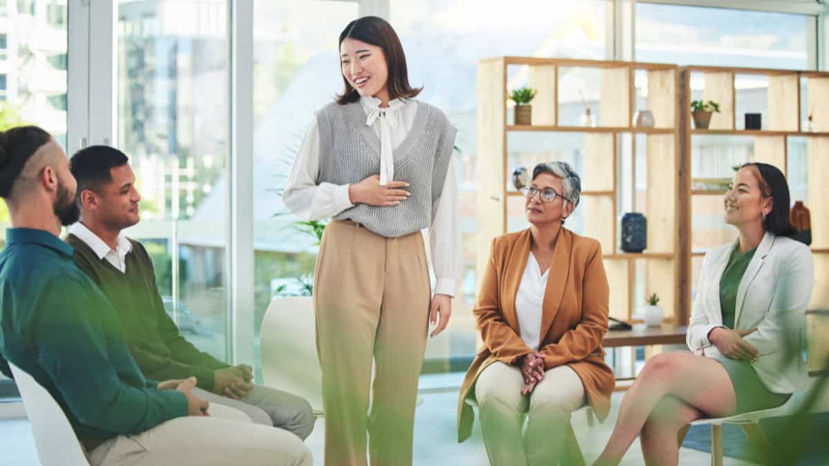 A woman shares her experience during group therapy through newark drug and alcohol rehab resources